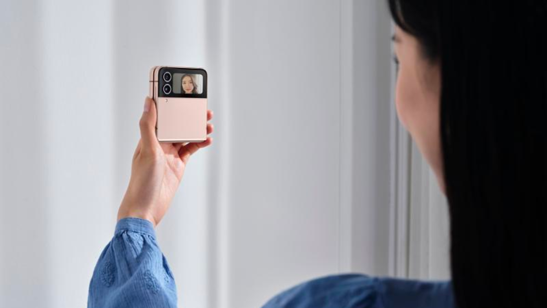 Use the back camera when taking a selfie on a flip phone